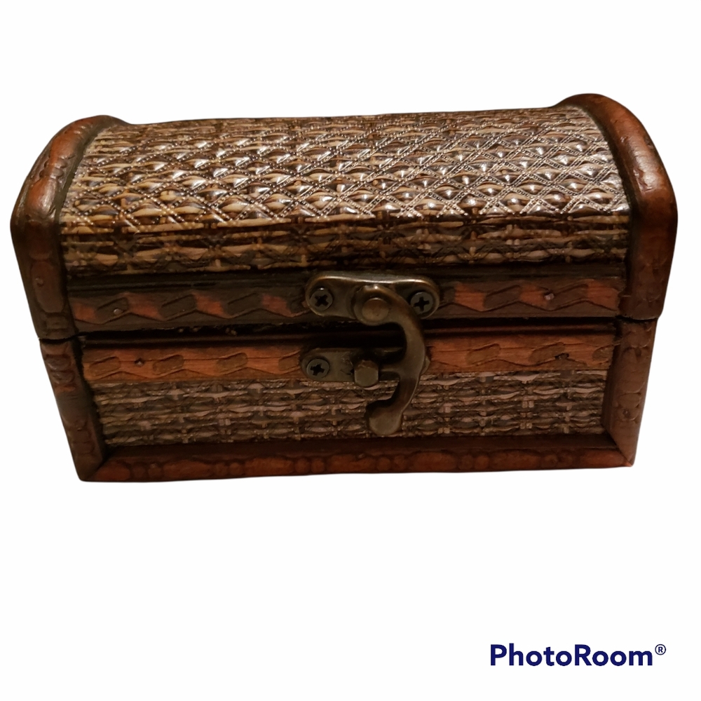 Vintage small wooden treasure chest with brass latch.